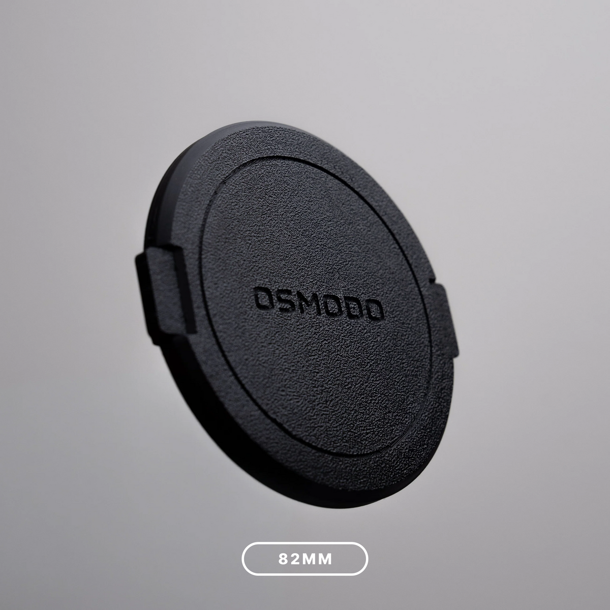 Black OSMODO Lens Cap with an 82mm size label, for compatible OSMODO adapters with an 82mm filter opening.