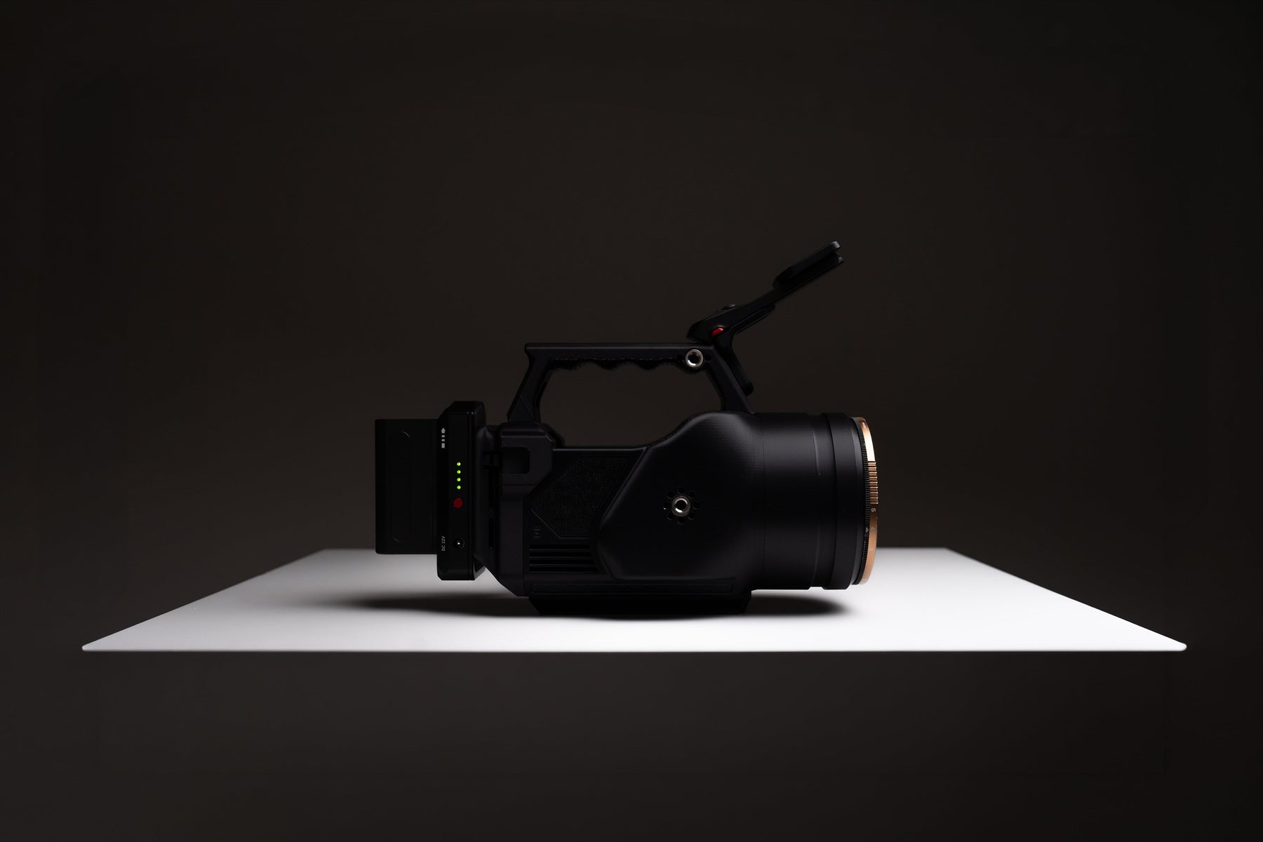 OSMODO 2 cinema-box camera rig with top handle and external battery on a studio surface