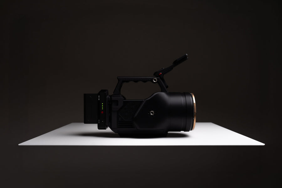 OSMODO 2 cinema-box camera rig with top handle and external battery on a studio surface