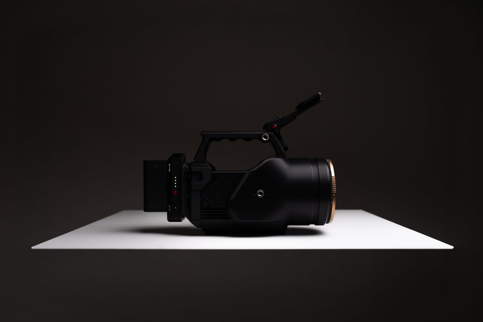 OSMODO 2 cinema-box camera rig with top handle and external battery on a studio surface